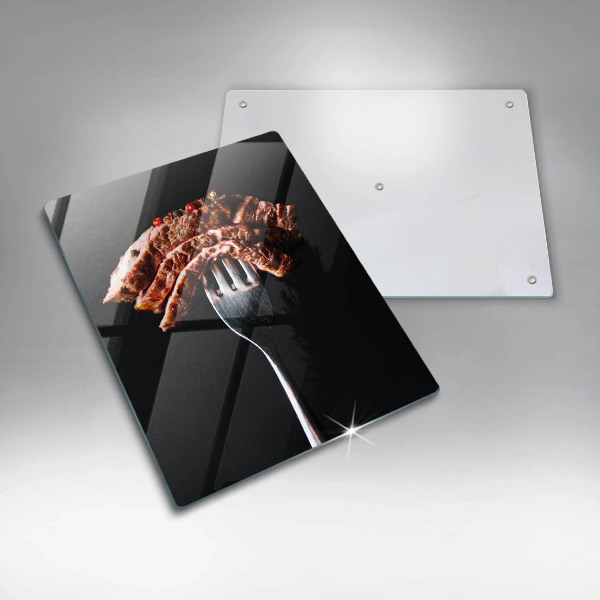 Glass worktop saver Meat on a fork