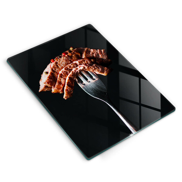 Glass worktop saver Meat on a fork