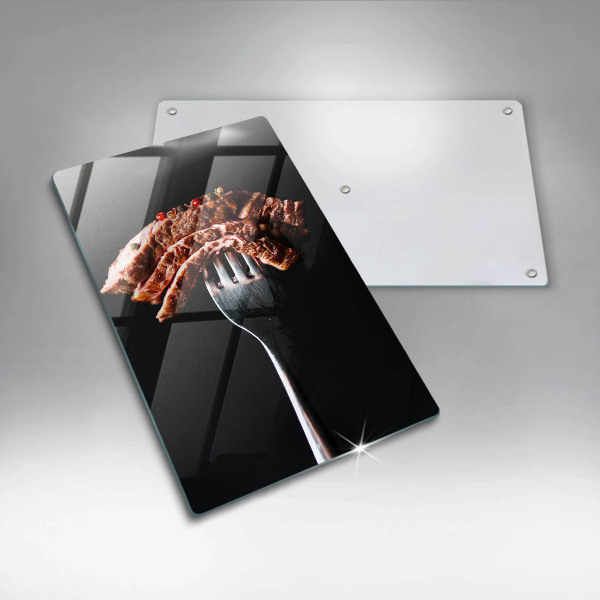 Glass worktop saver Meat on a fork
