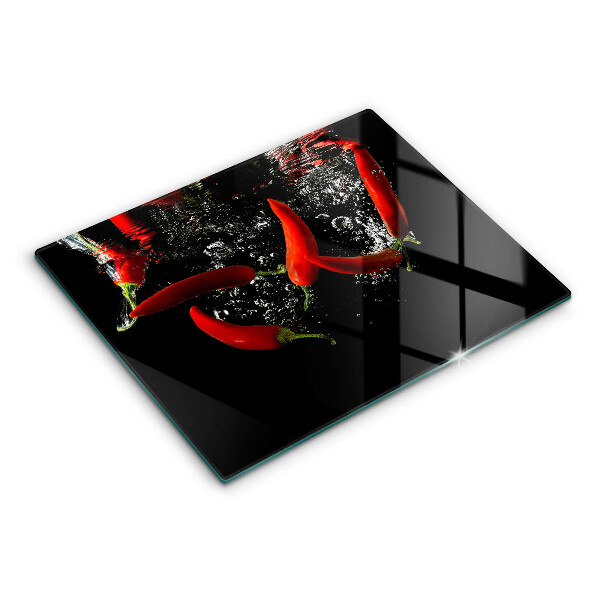 Chopping board glass Chili peppers in water