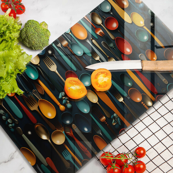 Chopping board Colorful spoons and forks
