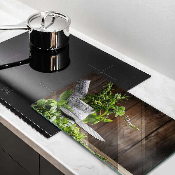 Chopping board glass Herbs plants and wood
