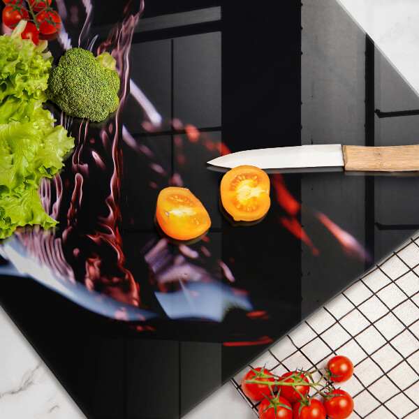 Chopping board glass A glass of red wine