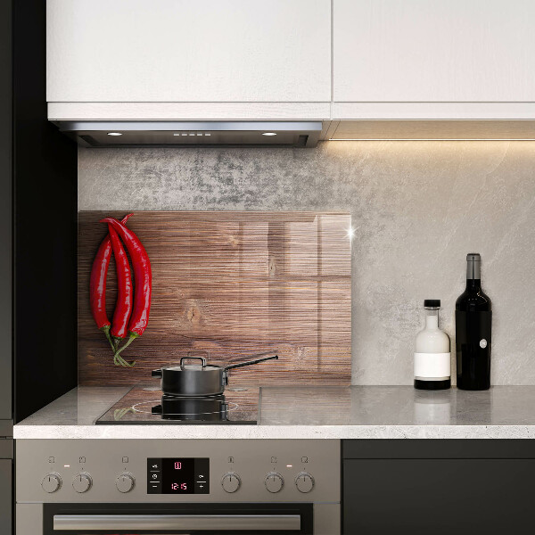 Glass cutting board Chili peppers on wood