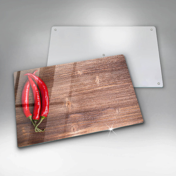 Glass cutting board Chili peppers on wood