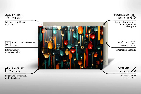 Chopping board glass Colorful spoons and forks