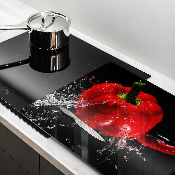 Chopping board glass Red peppers in water