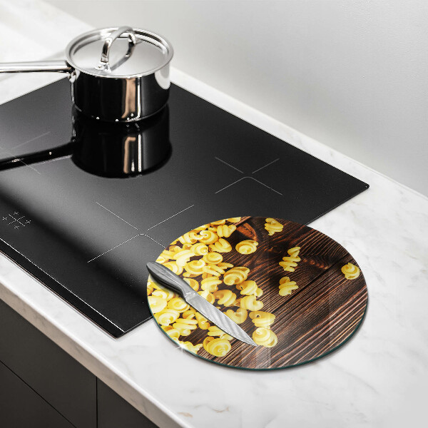 Chopping board glass Pasta on a table