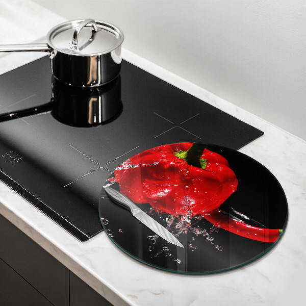 Glass worktop saver Red peppers in water