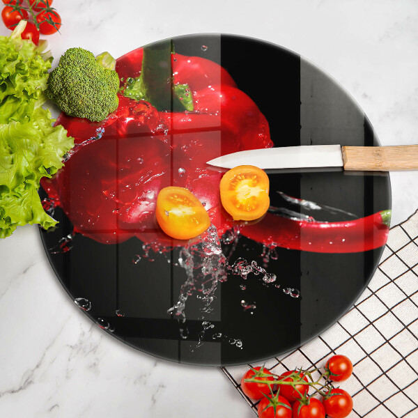 Glass worktop saver Red peppers in water
