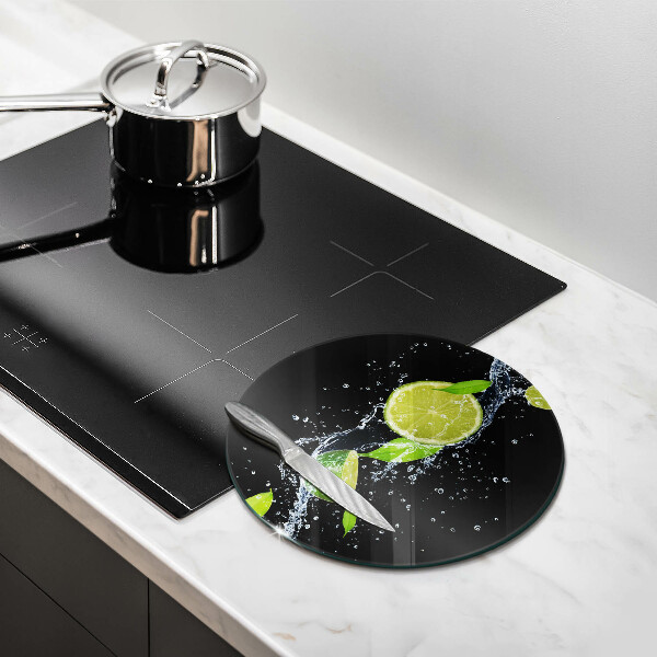Glass worktop saver Juicy lime in water