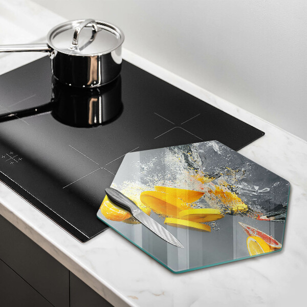 Chopping board glass Lemons in water