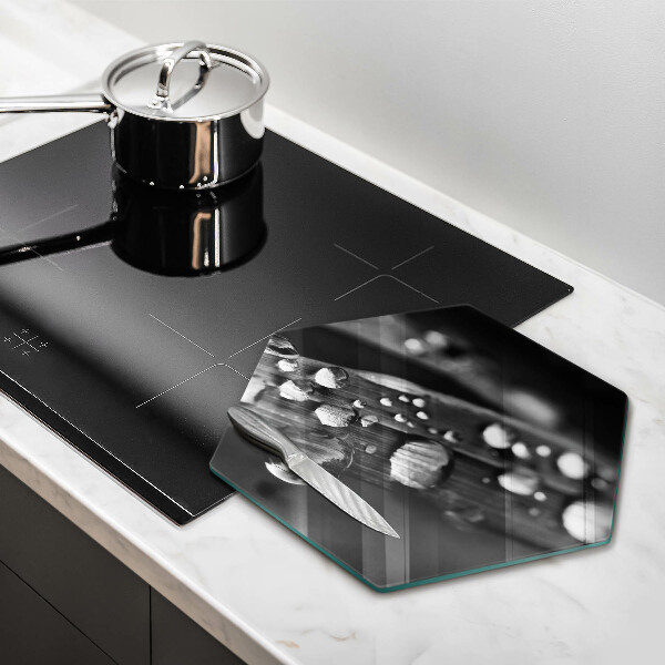 Glass chopping board Drops of dew on the leaves