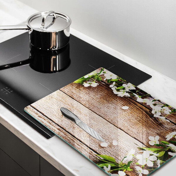Glass worktop saver White flowers on the boards