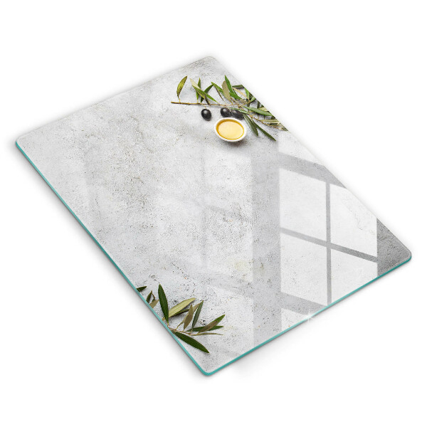 Glass worktop saver Olives on concrete