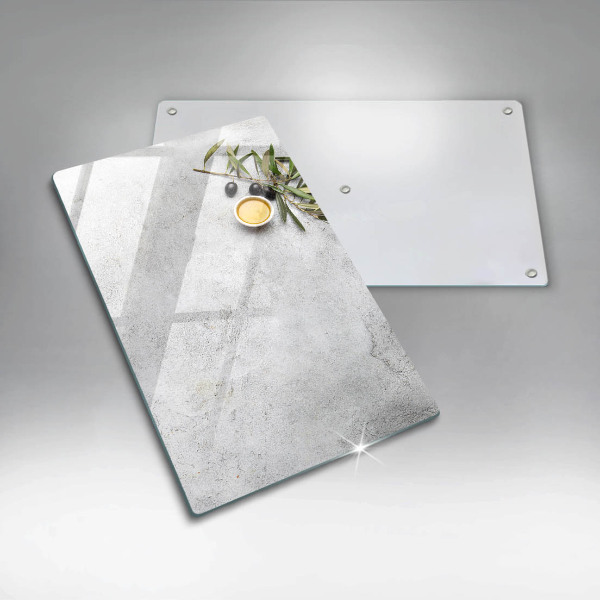 Glass worktop saver Olives on concrete