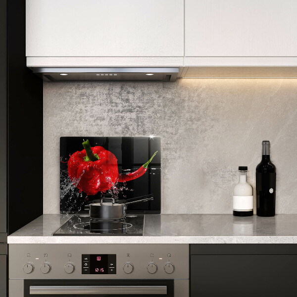 Induction hob protector Red peppers in water