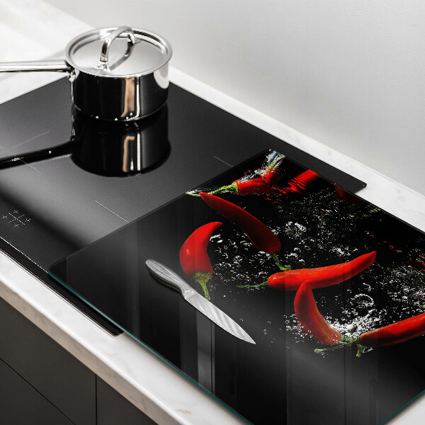 Work surface savers Chili peppers in water