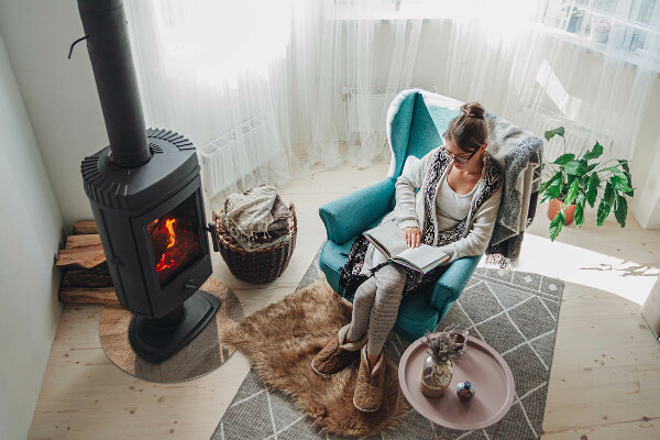 Round glass wood burner hearth Natural stone texture