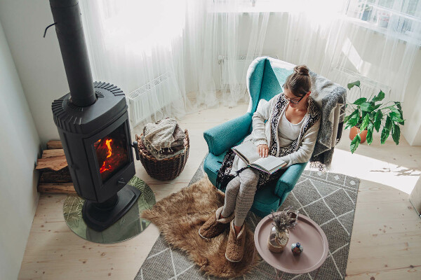 Round glass hearths for wood burners Tropical leaves in the background