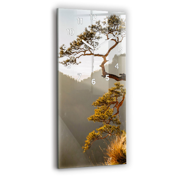 Modern vertical wall clock A tree in the mountains
