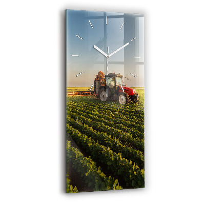 Modern vertical wall clock Tractor in a farm field