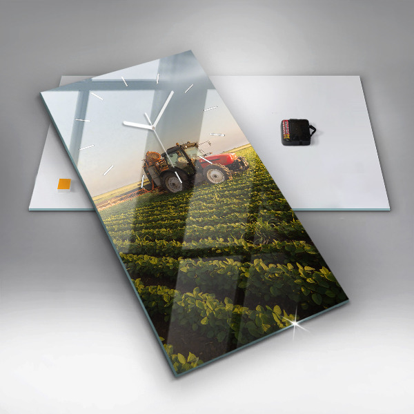 Modern vertical wall clock Tractor in a farm field