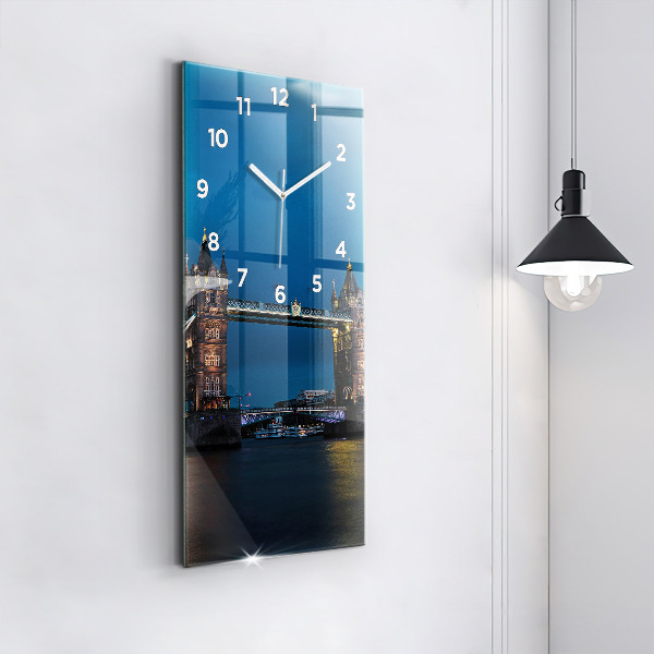 Modern vertical wall clock Tower Bridge London at night
