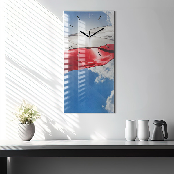 Modern vertical wall clock The Polish flag against the sky