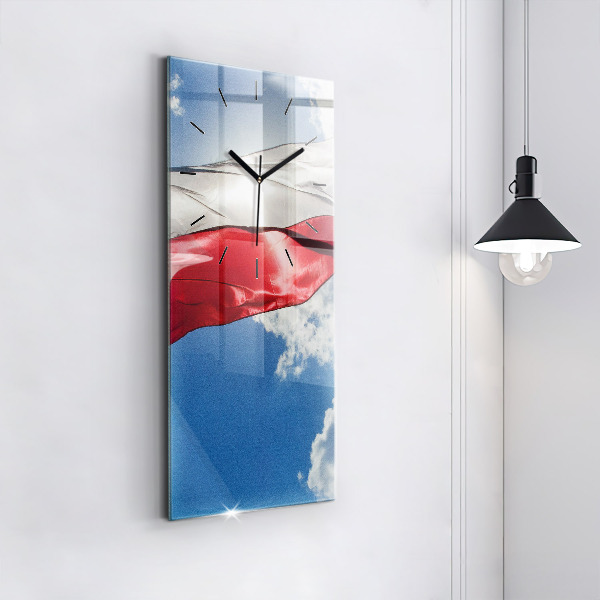 Modern vertical wall clock The Polish flag against the sky