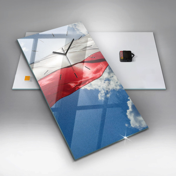 Modern vertical wall clock The Polish flag against the sky