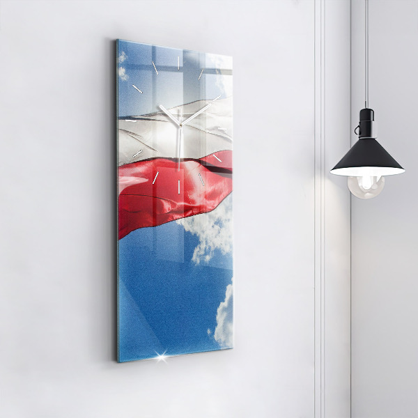 Modern vertical wall clock The Polish flag against the sky