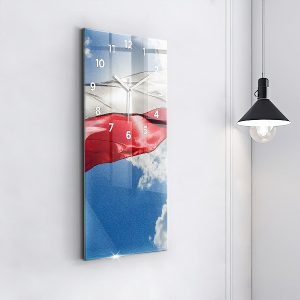 Modern vertical wall clock The Polish flag against the sky