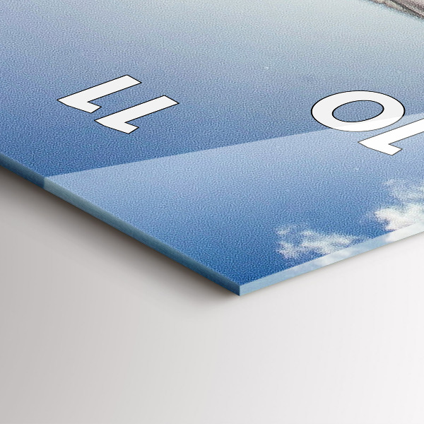 Modern vertical wall clock The Polish flag against the sky