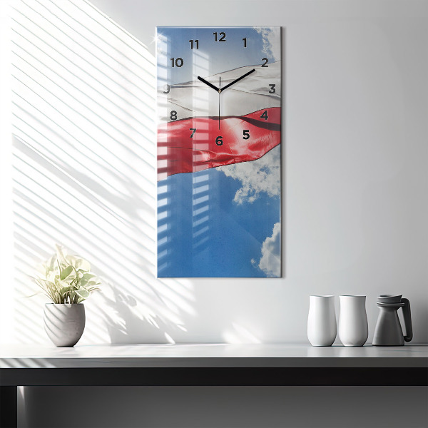 Modern vertical wall clock The Polish flag against the sky
