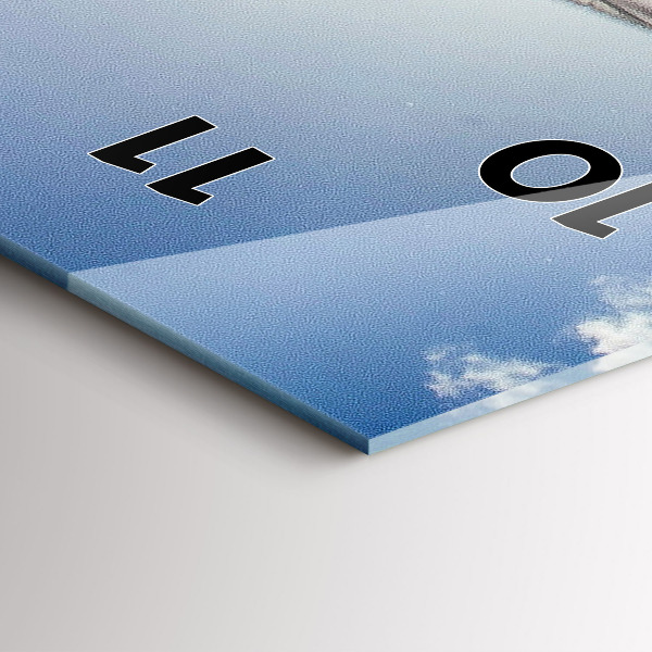 Modern vertical wall clock The Polish flag against the sky