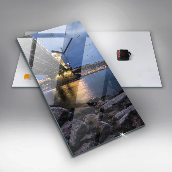 Modern vertical wall clock Rocky shore under the bridge