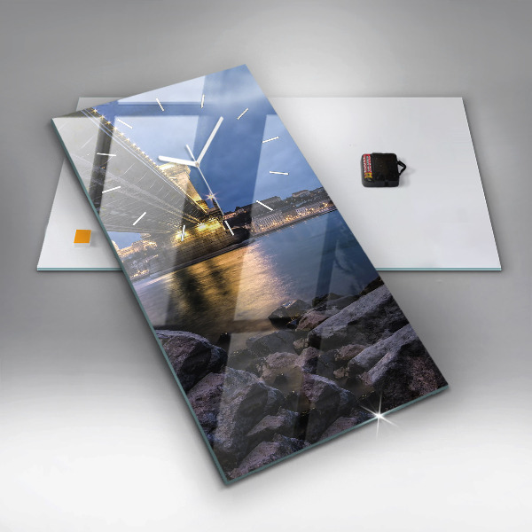 Modern vertical wall clock Rocky shore under the bridge