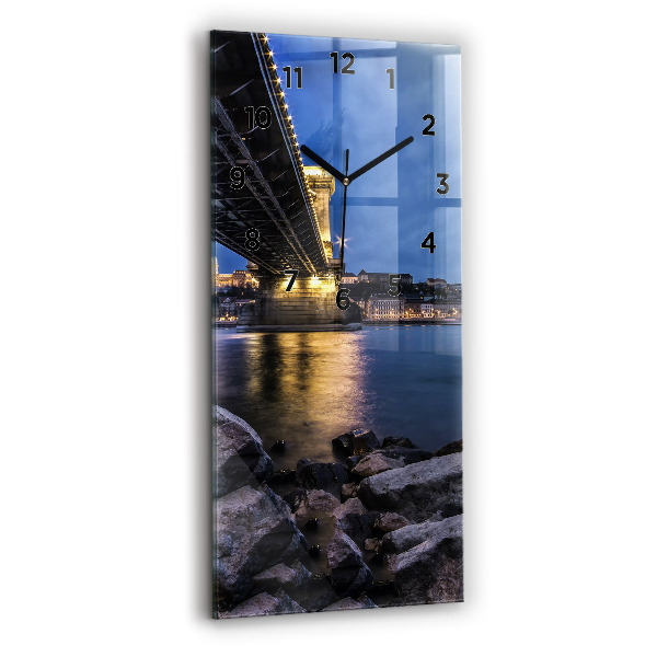 Modern vertical wall clock Rocky shore under the bridge