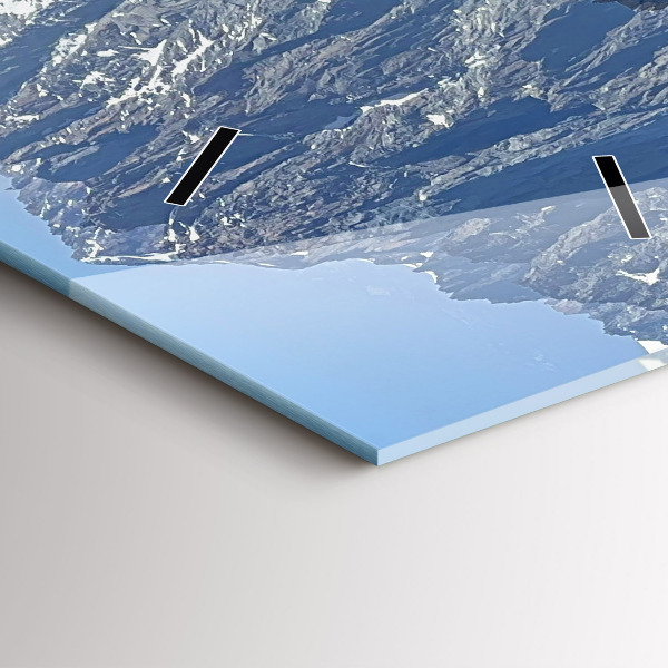 Modern vertical wall clock Alps Mountains in Winter