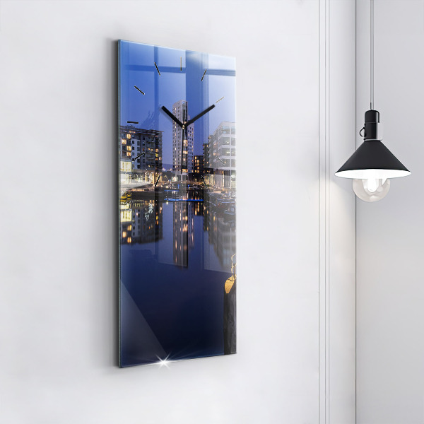 Modern vertical wall clock The city lit up at night
