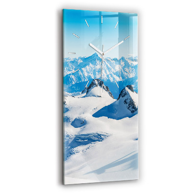 Modern vertical wall clock Skier in the Alps