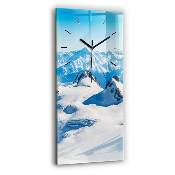 Modern vertical wall clock Skier in the Alps