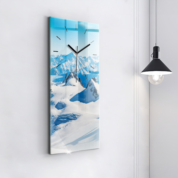Modern vertical wall clock Skier in the Alps