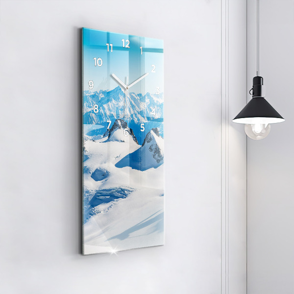 Modern vertical wall clock Skier in the Alps