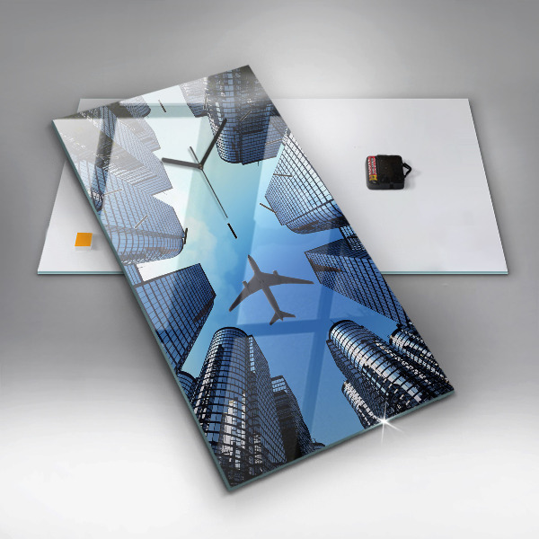 Modern vertical wall clock Airplane over buildings