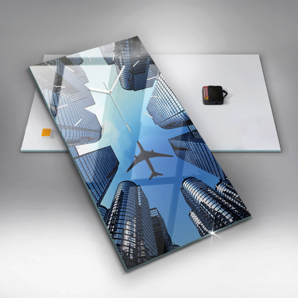 Modern vertical wall clock Airplane over buildings