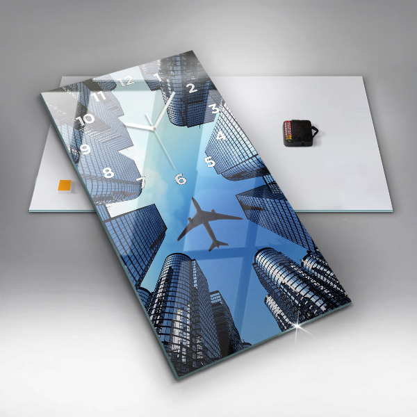 Modern vertical wall clock Airplane over buildings