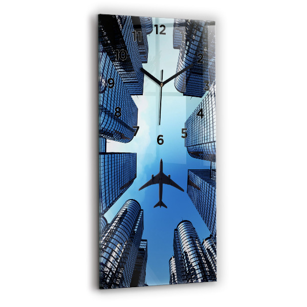 Modern vertical wall clock Airplane over buildings