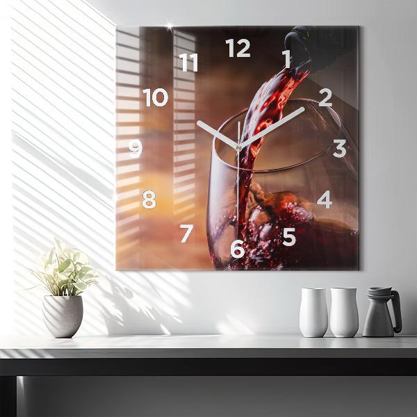 Square glass wall clock A glass of red wine